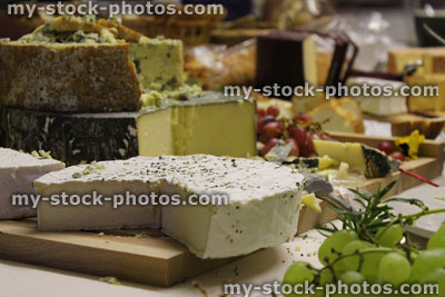 Stock image of luxury cheese board with brie, Stilton, Cornish Yarg, Cheddar