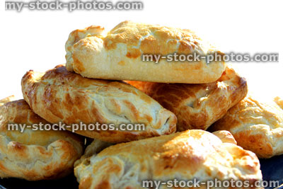 Stock image of freshy baked Cornish pasties / pasty, isolated background