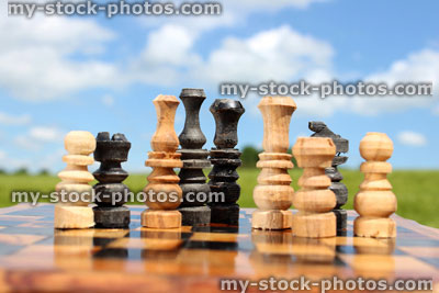 Stock image of chessboard game / wooden chess board against sky, boardgame