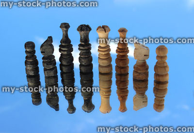 Stock image of wooden chess pieces reflected against sky / chess set reflection / floating