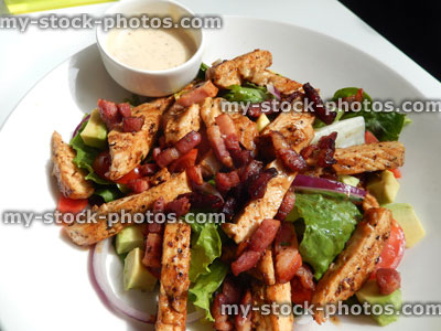 Stock image of chicken, pancetta ham / bacon salad, avocado, spinach, avocado