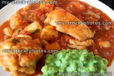 Stock image of chicken casserole meal with mushy peas, vegetables, gravy