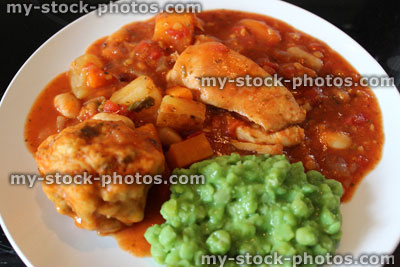 Stock image of chicken casserole meal with mushy peas, vegetables, gravy