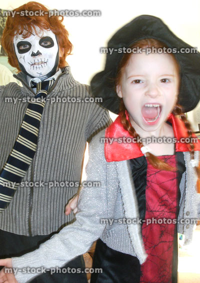 Stock image of children dressed in fancy-dress costumes for Halloween party