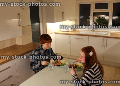Stock image of Children Having an Evening Meal