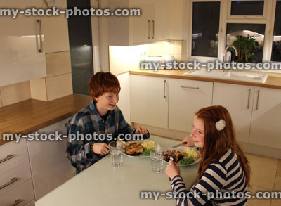 Stock image of Children Having an Evening Meal