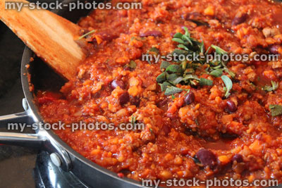 Stock image of healthy vegetarian chili con carne cooking, frying pan