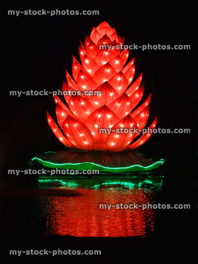 Stock image of Chinese Lantern Festival lights, illuminated Lotus flower, lake reflection