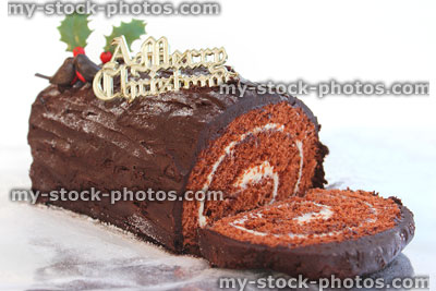 Stock image of sliced chocolate log cake at Christmas, tree rings