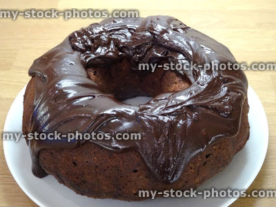 Stock image of homemade Bundt cake, beetroot / chocolate ring cake, ganache frosting / icing