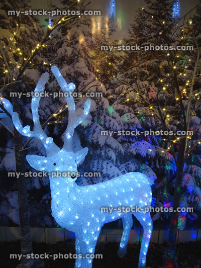 Stock image of large light up Christmas reindeer figure with LED lights / fairy lights, winter display