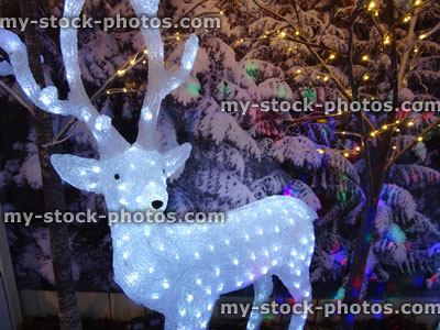 Stock image of large light up Christmas reindeer figure with LED lights / fairy lights, winter display
