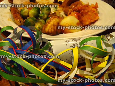 Stock image of Christmas dinner, roast turkey, Brussels sprouts, gravy, roast potatoes, crackers, streamers