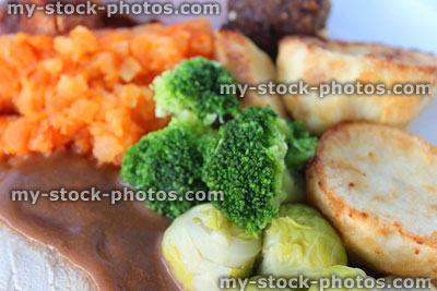 Stock image of roast dinner with chicken, sprouts, potatoes, swede, gravy