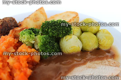 Stock image of roast dinner with seasonal winter vegetables and sliced turkey