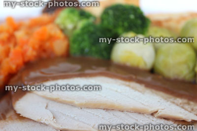 Stock image of roast chicken dinner with vegetables, potatoes and gravy