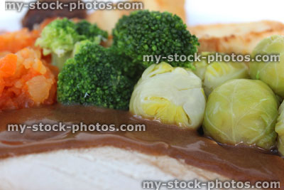 Stock image of roast dinner with slices of chicken and vegetables