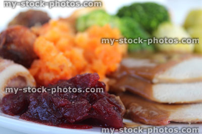 Stock image of Christmas dinner with cranberry sauce, sprouts and turkey