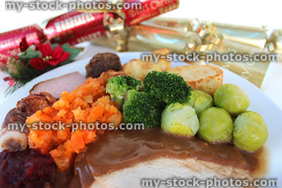 Stock image of Christmas dinner plate, carrots, swede, sprouts, turkey, crackers