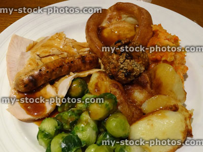 Stock image of Christmas dinner, roast turkey, Brussels sprouts, gravy, roast potatoes, Yorkshire pudding