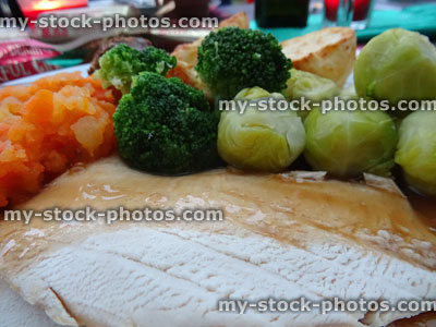 Stock image of roast turkey dinner, slices of meat with gravy