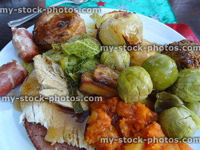 Stock image of roast dinner plate, sprouts, mashed carrot, chicken, gravy