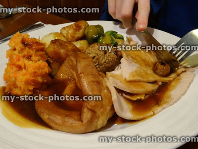 Stock image of Christmas dinner, roast turkey, Brussels sprouts, gravy, roast potatoes, Yorkshire pudding