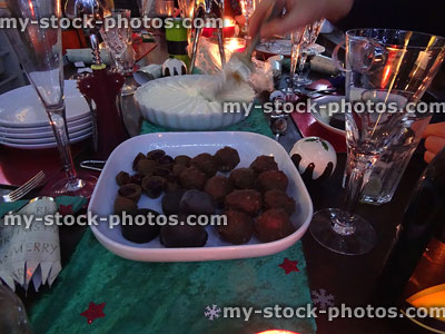 Stock image of evening buffet meal at Christmas-time with candles, crackers