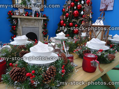 Stock image of Christmas dining table, Xmas tree decorations and fireplace