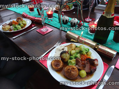 Stock image of Christmas dinner table settings with plates of food
