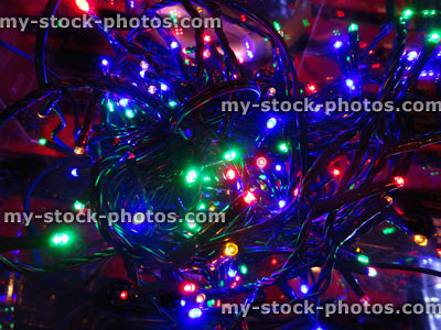 Stock image of tangled multi coloured Christmas tree fairy lights, twinkling xmas lights