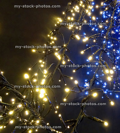 Stock image of defocused blue and white Christmas lights background, bokeh
