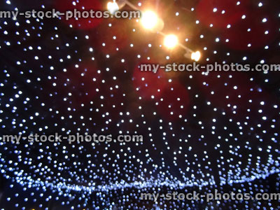 Stock image of strings of white Christmas lights background, LED fairy lights