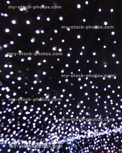 Stock image of strings of white Christmas lights background, LED fairy lights