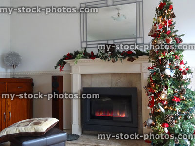 Stock image of fireplace with garland decorations, fairylights and Christmas tree
