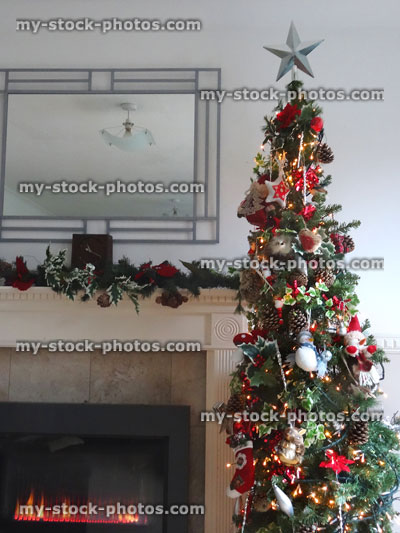 Stock image of gas fire / fireplace decorated with garland, Christmas tree