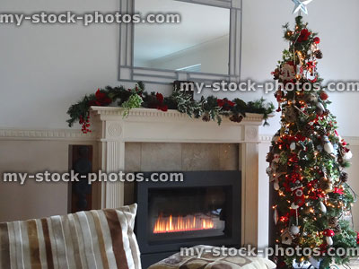 Stock image of living room / gas fireplace with Christmas tree decorations