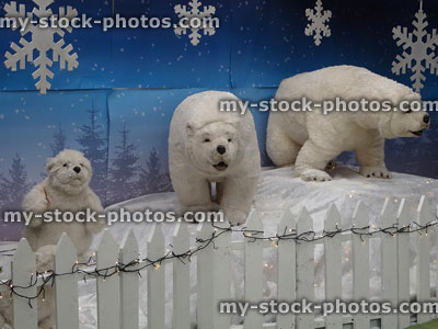 Stock image of Christmas display of polar bear toys with snowflakes