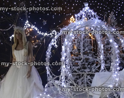 Stock image of Christmas winter display, Cinderella princess with pumpkin carriage, snow, fairy lights