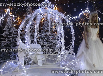 Stock image of Christmas winter display, Cinderella princess with pumpkin carriage, snow, fairy lights