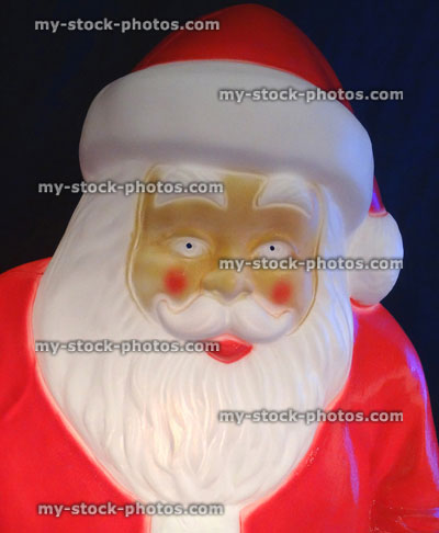 Stock image of large cuddly life size cartoon illuminated Santa Claus / Father Christmas, plastic light, winter display