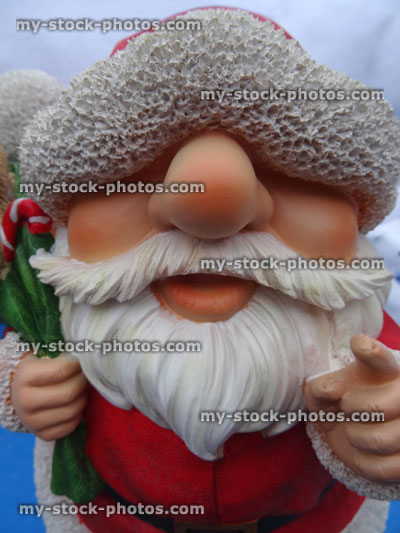 Stock image of resin cartoon toy Santa Claus / Father Christmas, white beard, garden ornament