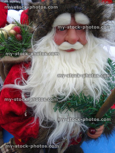 Stock image of large cuddly life size cartoon Santa Claus / Father Christmas, white beard, winter display