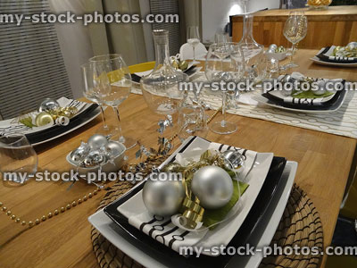 Stock image of Christmas dining table placemats / place-settings, baubles and decorations