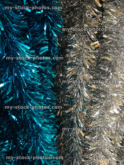 Stock image of coloured tinsel Christmas decorations, turquoise blue and silver