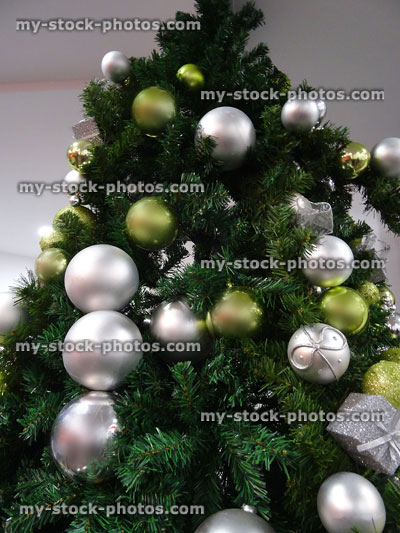 Stock image of Christmas tree with silver and green baubles / decorations