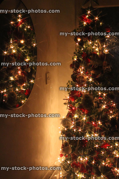 Stock image of defocused Christmas tree white led fairy lights, mirror reflection