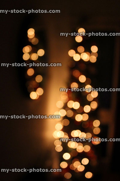 Stock image of defocused Christmas tree white led fairy lights, mirror reflection