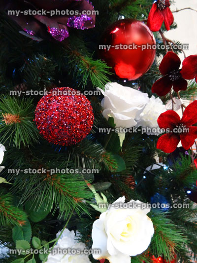 Stock image of artificial Christmas-tree with baubles, roses, flowers and decorations