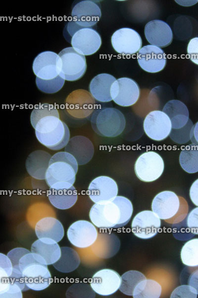Stock image of defocused Christmas tree white led fairy lights, night background, bokeh